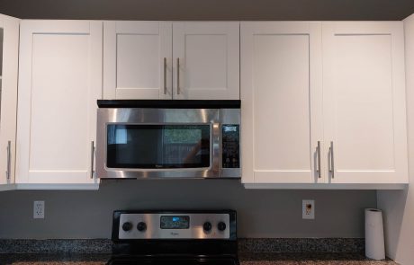 White refinished cabinets of a kitchen in Shawnigan Victoria