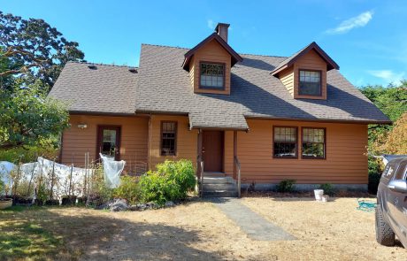 Brown and tanned house with painted horizontal siding