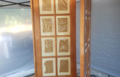 Stained door with window panels