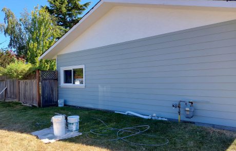 Painting the side of a house with horizontal siding in grey