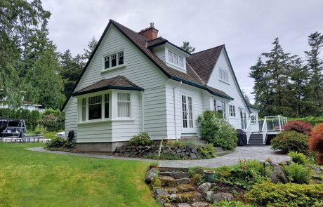 House with landscaping and a back patio in Arbutus Cove Victoria BC