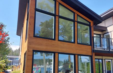 modern designed house with wood panels and black window frames in sidney victoria