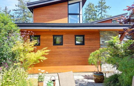 modern house made of horizontal wood siding and masonry in sidney victoria