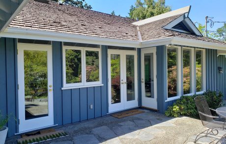 back door of a blue painted home and white window and door frames in uplands victoria