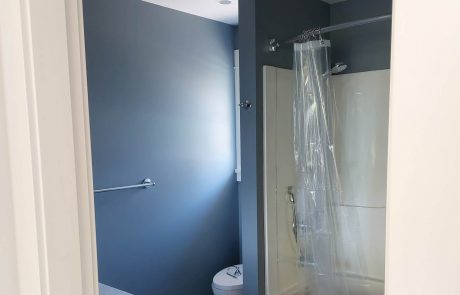 bathroom with dark grey painted walls of an oak bay home in victoria