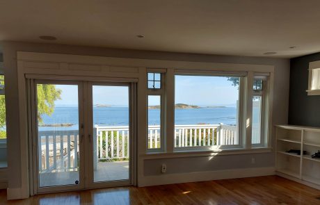 Ocean view from inside a living room of a Oak Bay Victoria house