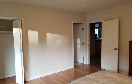 bedroom with hardwood and light beige painted walls